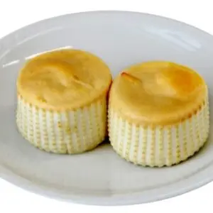 A handcrafted smoked burrata from La Mozz, featuring a golden-brown mozzarella shell encasing a creamy, stracciatella-filled center.